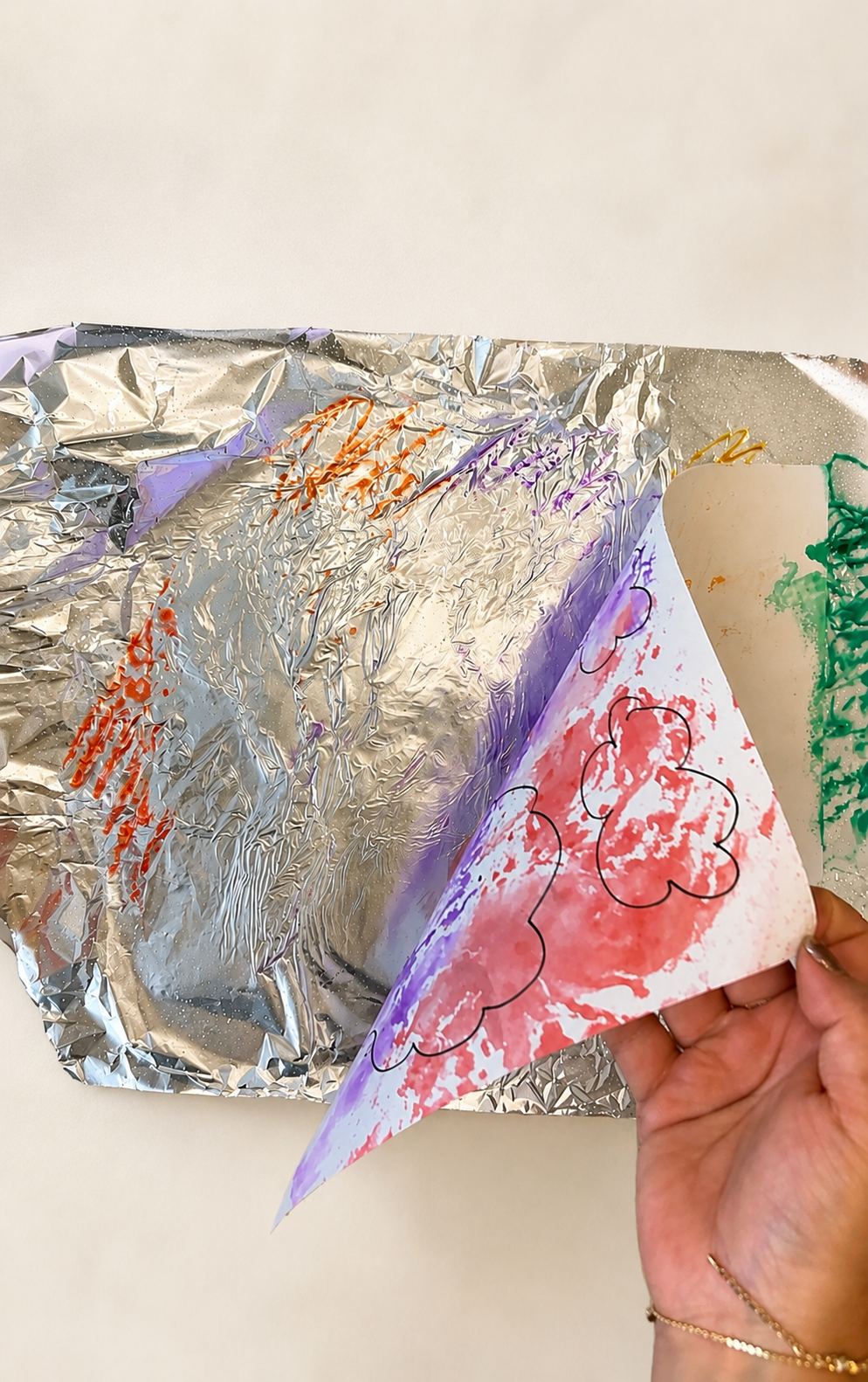 Preschool foil marker print art with colorful marker prints transferred from aluminum foil onto paper